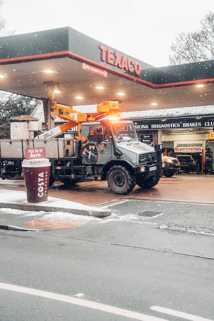 services-02 A service truck at a Texaco station during a snowy winter day in the UK. Transportation in cold weather.